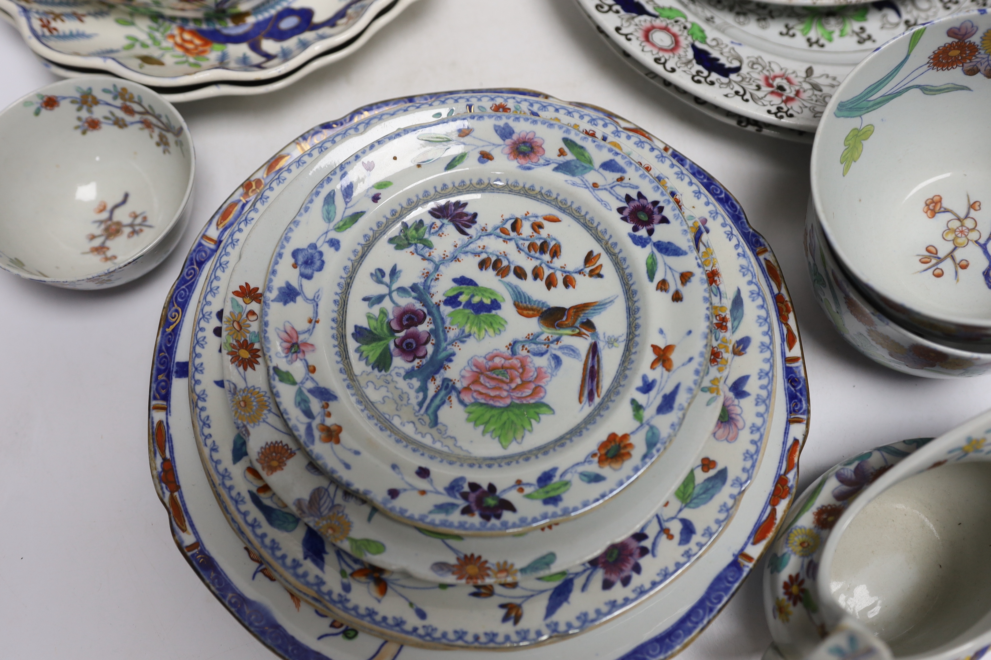 A collection of Spode Ironstone and pottery blue tea and dinnerware, including a pair of oval boat shaped sauce tureens and covers and a pair of shell shaped dessert dishes